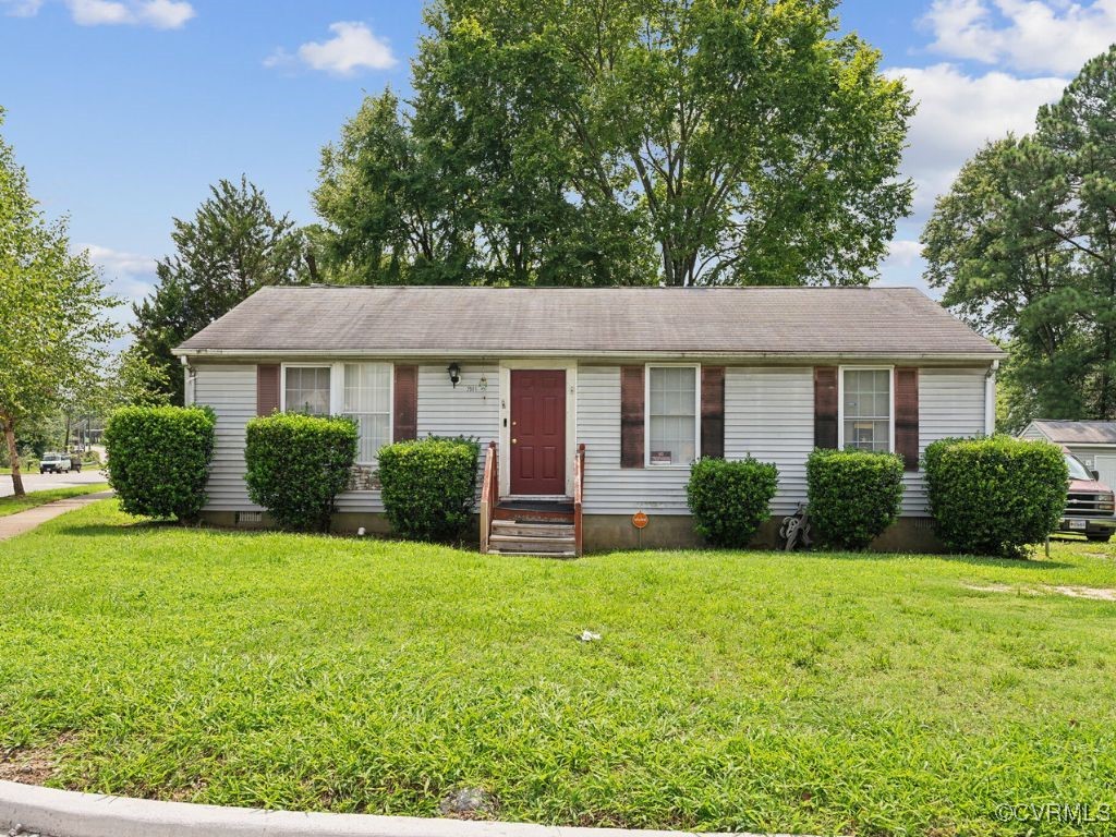 Single story home featuring a front yard