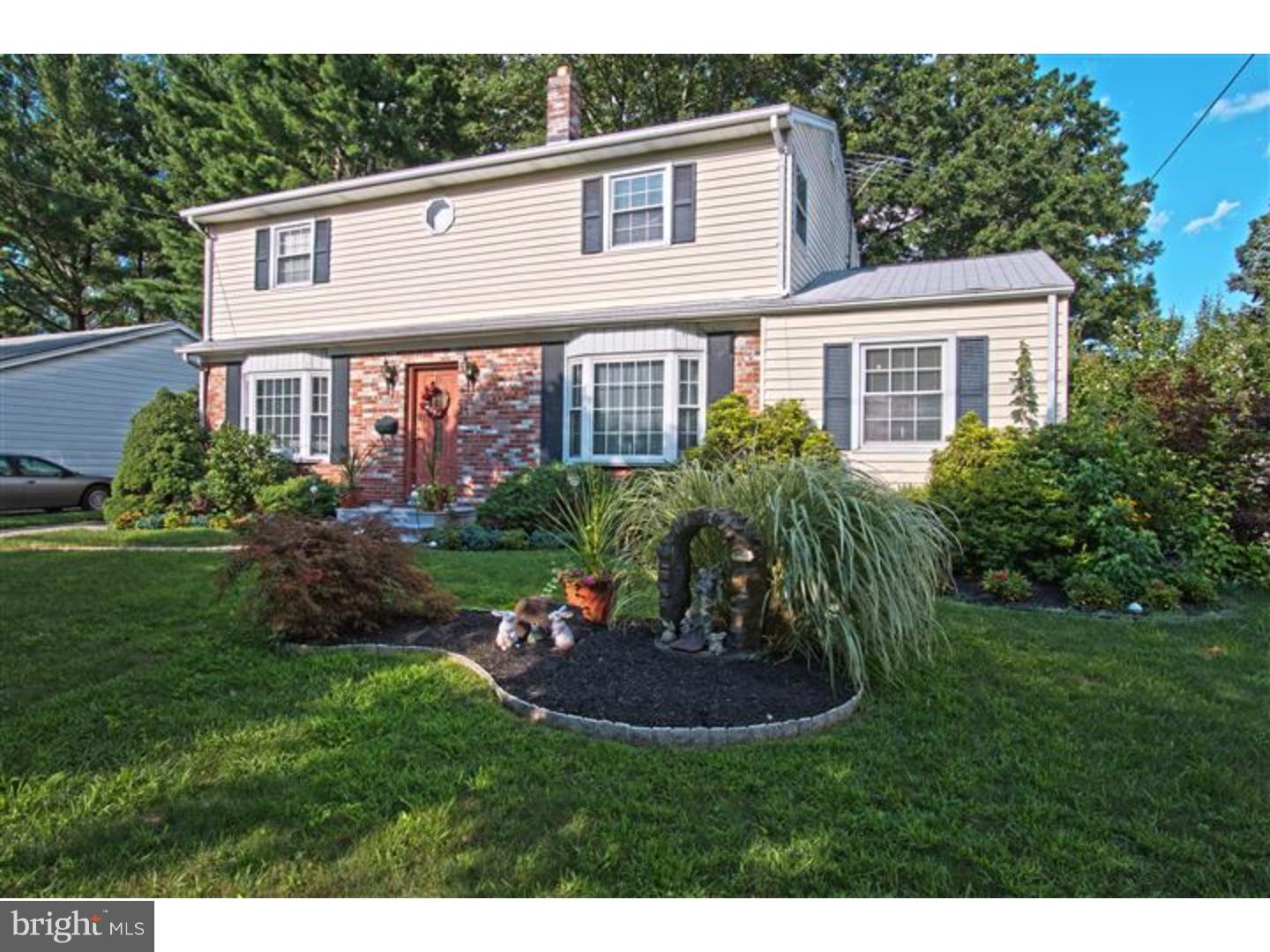 a view of a house with a yard and plants