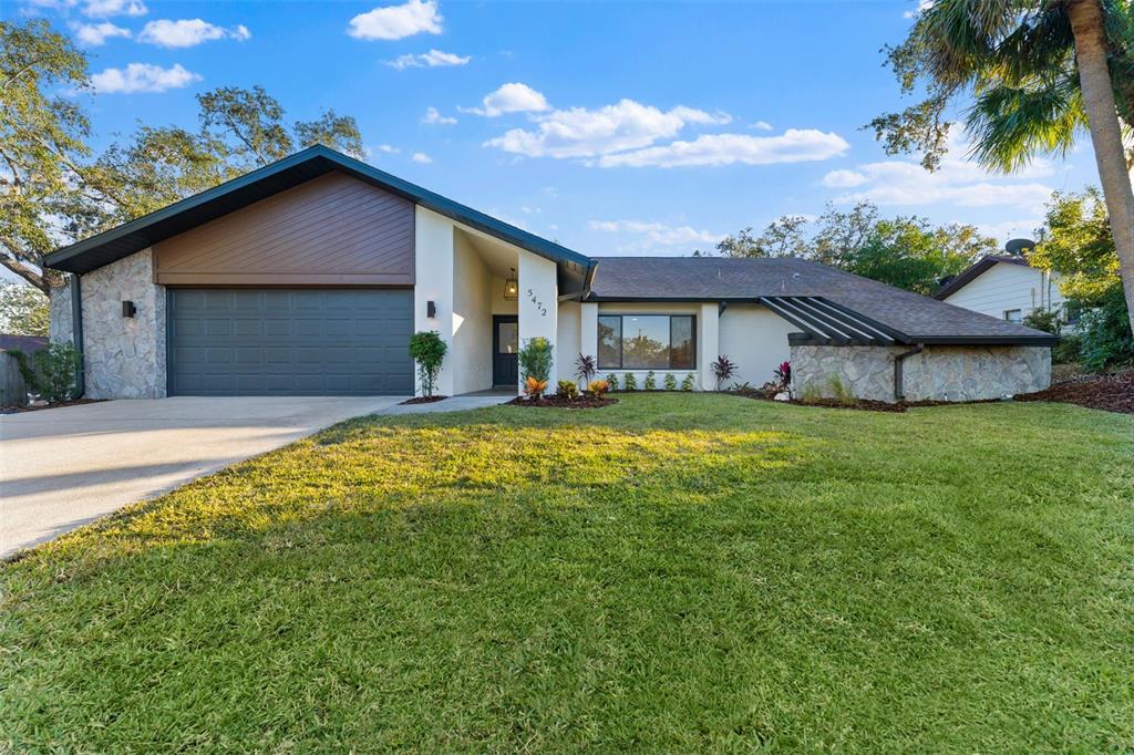 a house view with a garden space