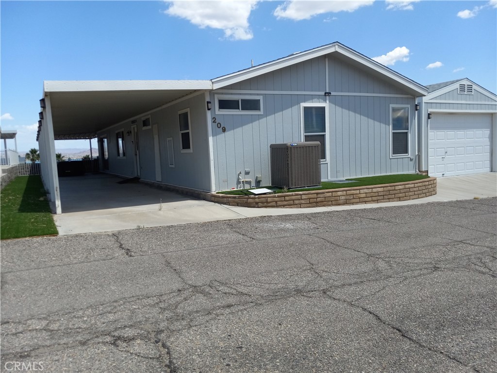 a front view of a house with garage