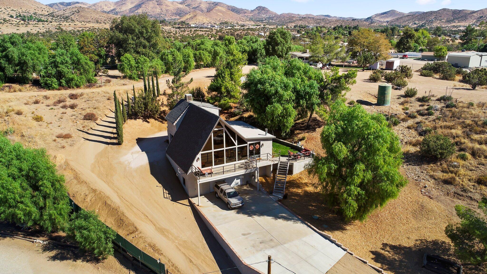 a view of a house with a mountain in the background