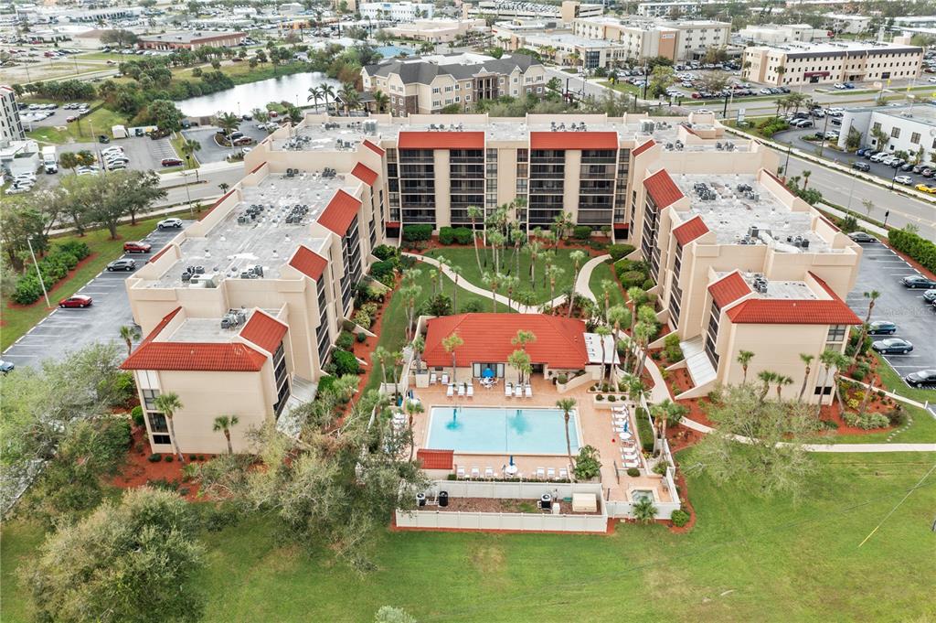 an aerial view of multiple houses with yard