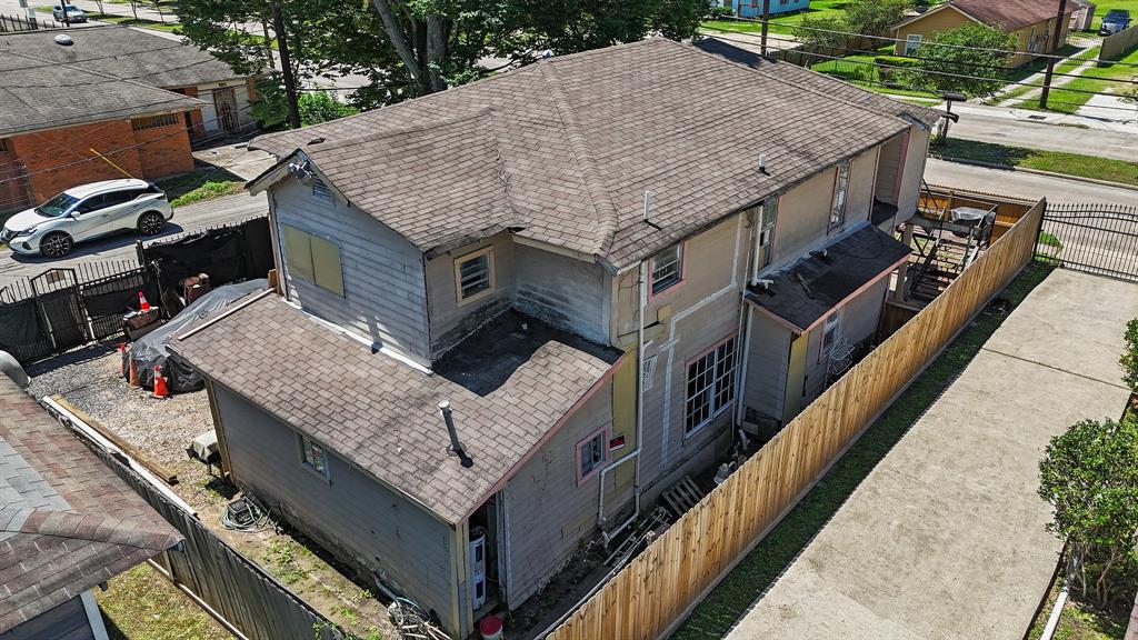 a aerial view of a house with roof deck front of house