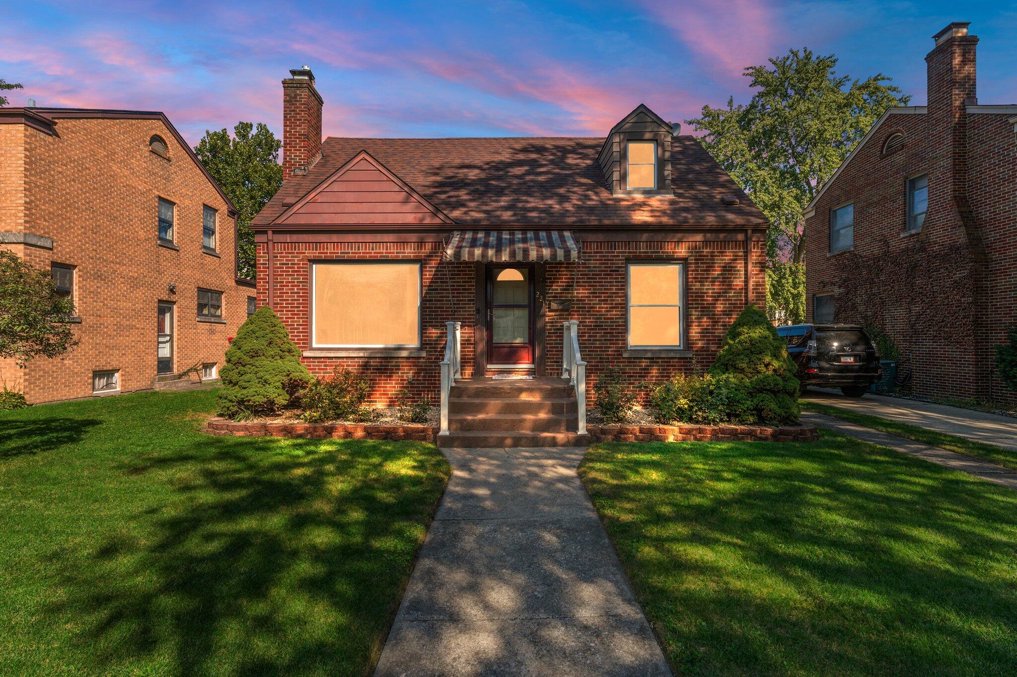 a front view of a house with a yard