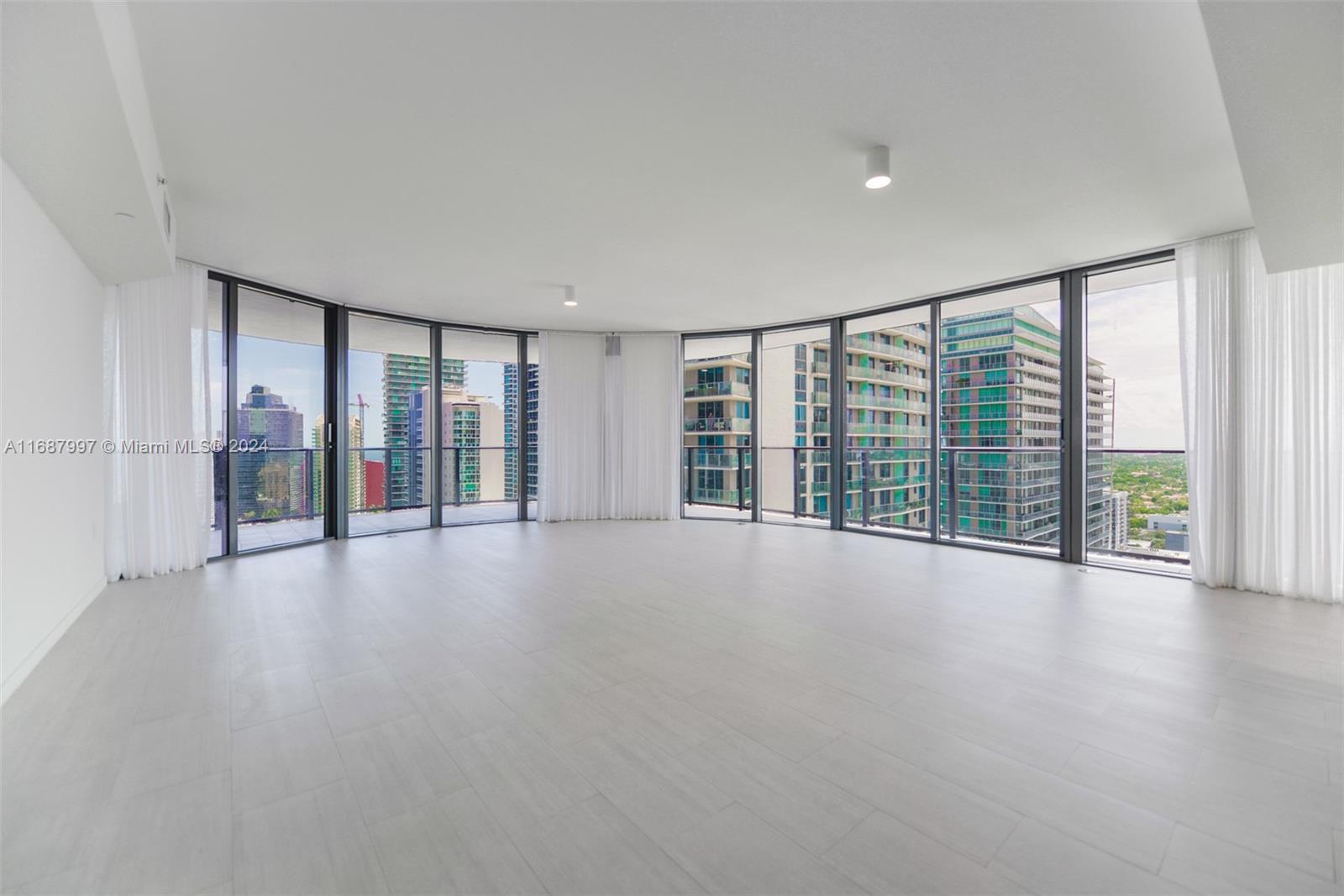 a view of an empty room with a balcony