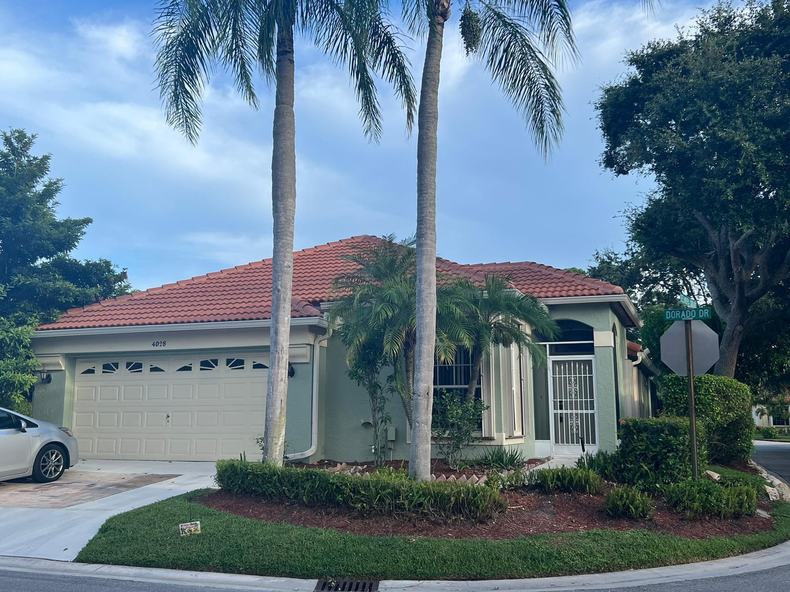 a front view of a house with garden