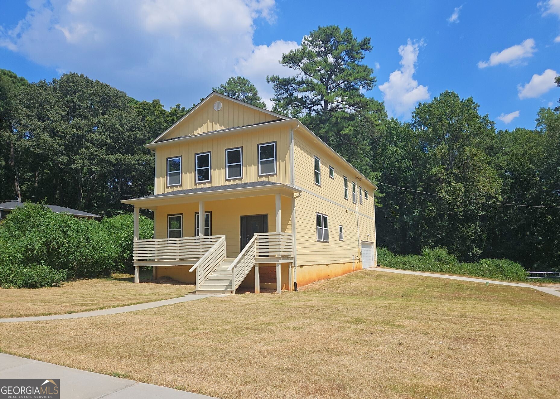 a front view of a house with a yard