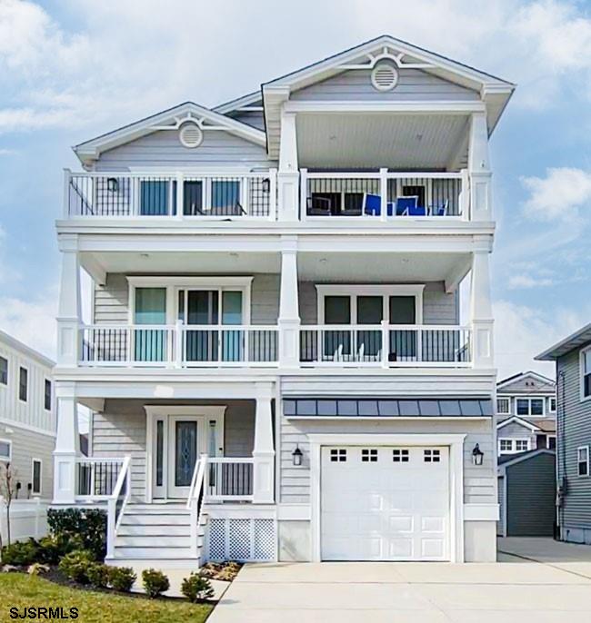 a front view of a residential apartment building with a yard