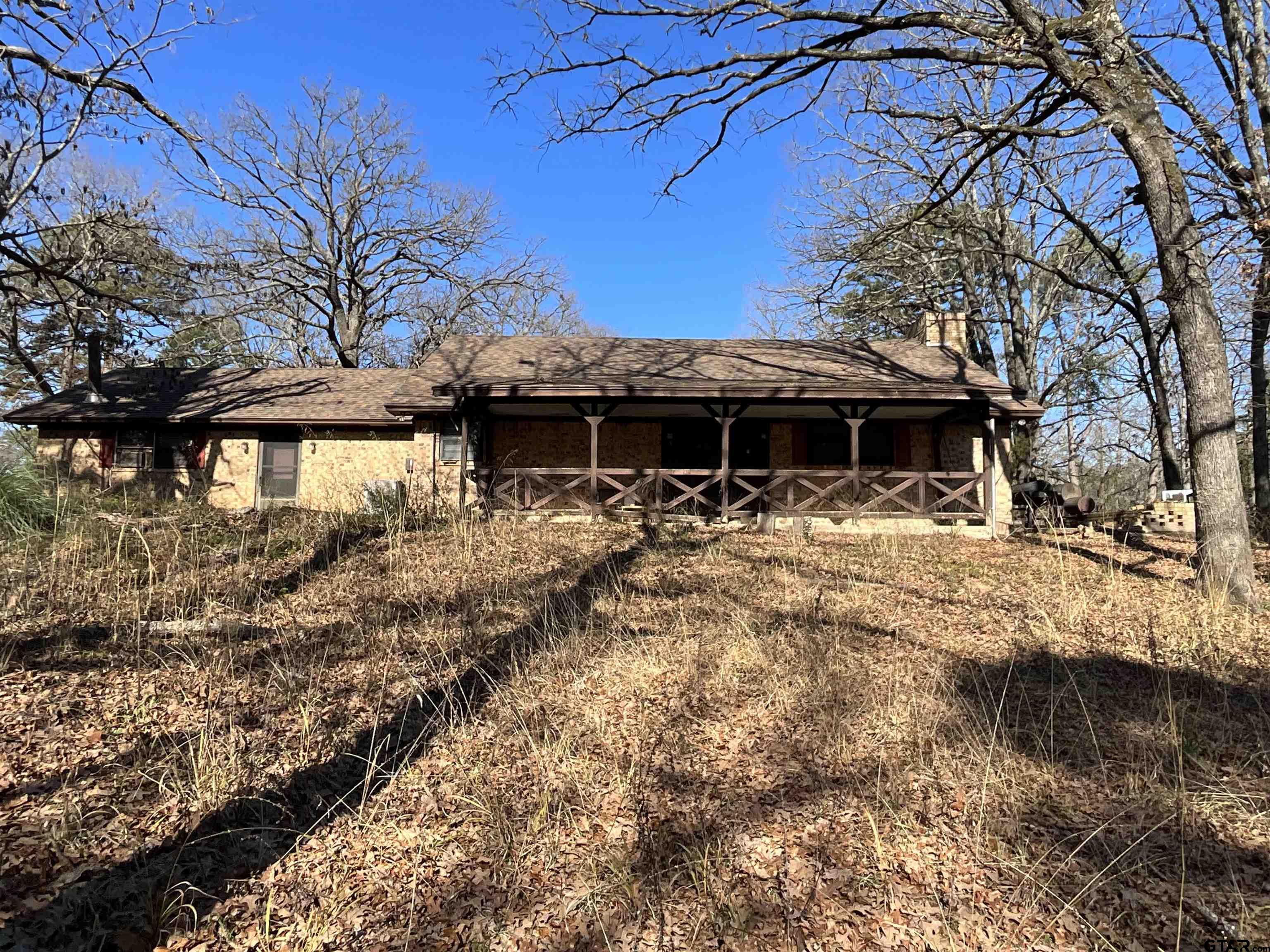 a view of house with a yard