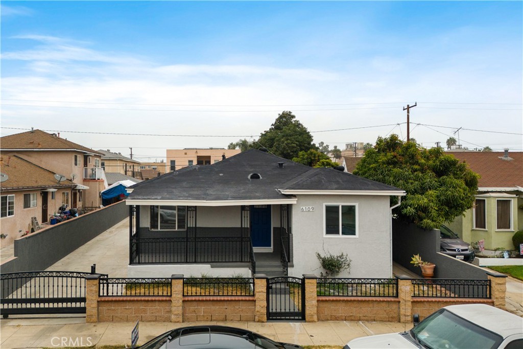 a view of house with outdoor space and sitting area