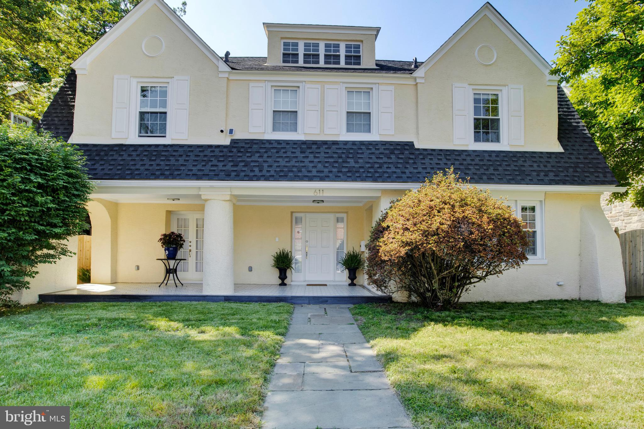 a front view of a house with garden