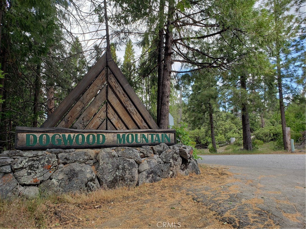 a view of a wooden fence next to a road