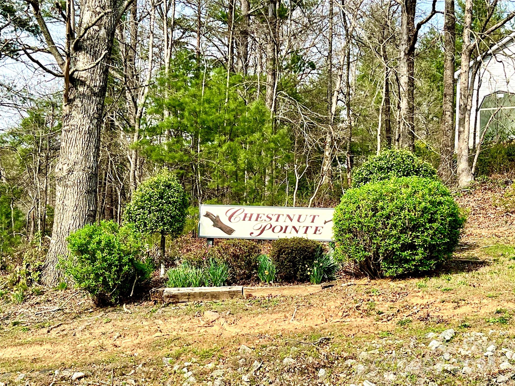 a sign that is in front of flowers