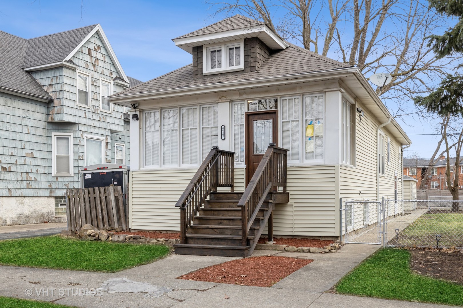 a front view of a house with a garden