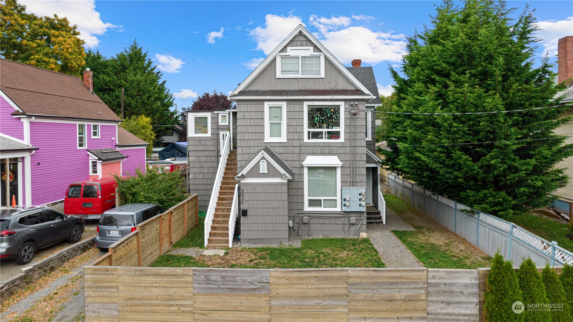 a front view of a house with a yard