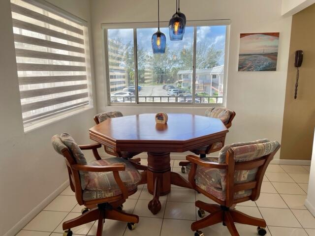 a view of a dining room with furniture and window