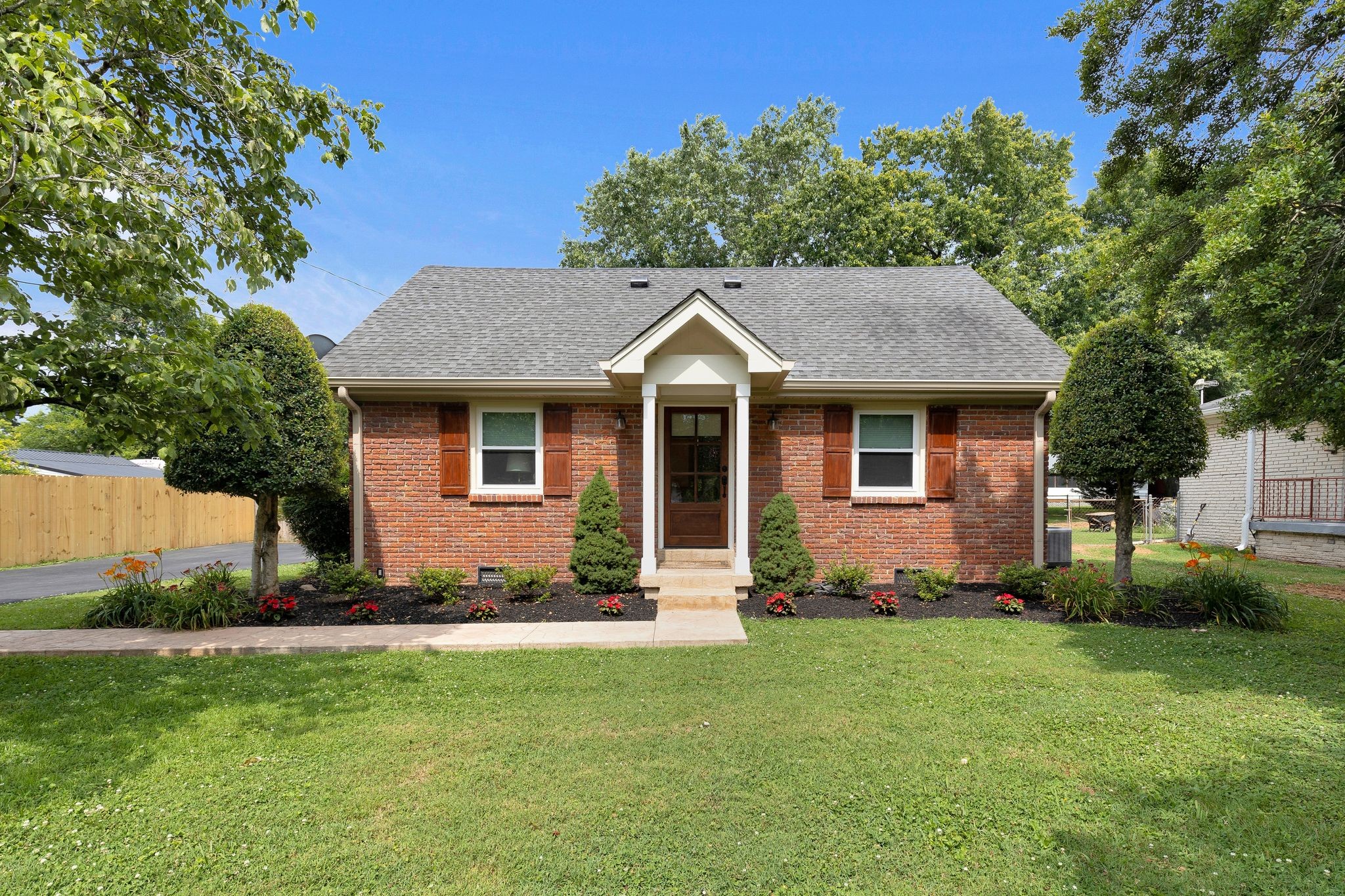 a front view of a house with a yard