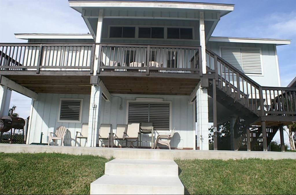 a view of a house with couches in front of house