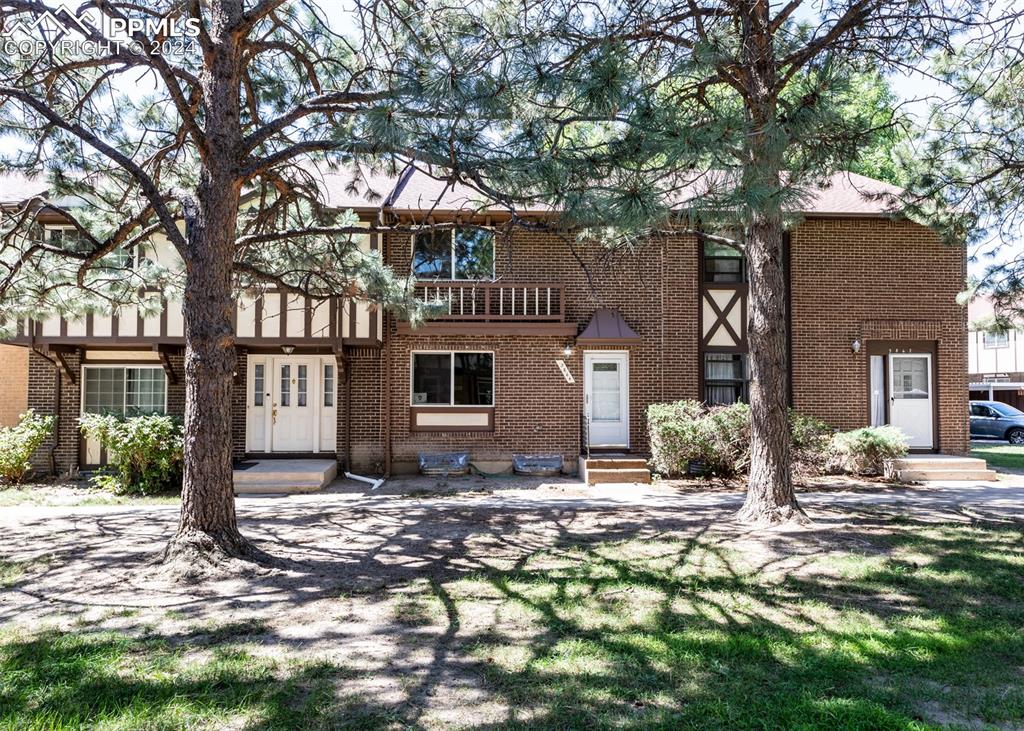 a front view of a house with a yard