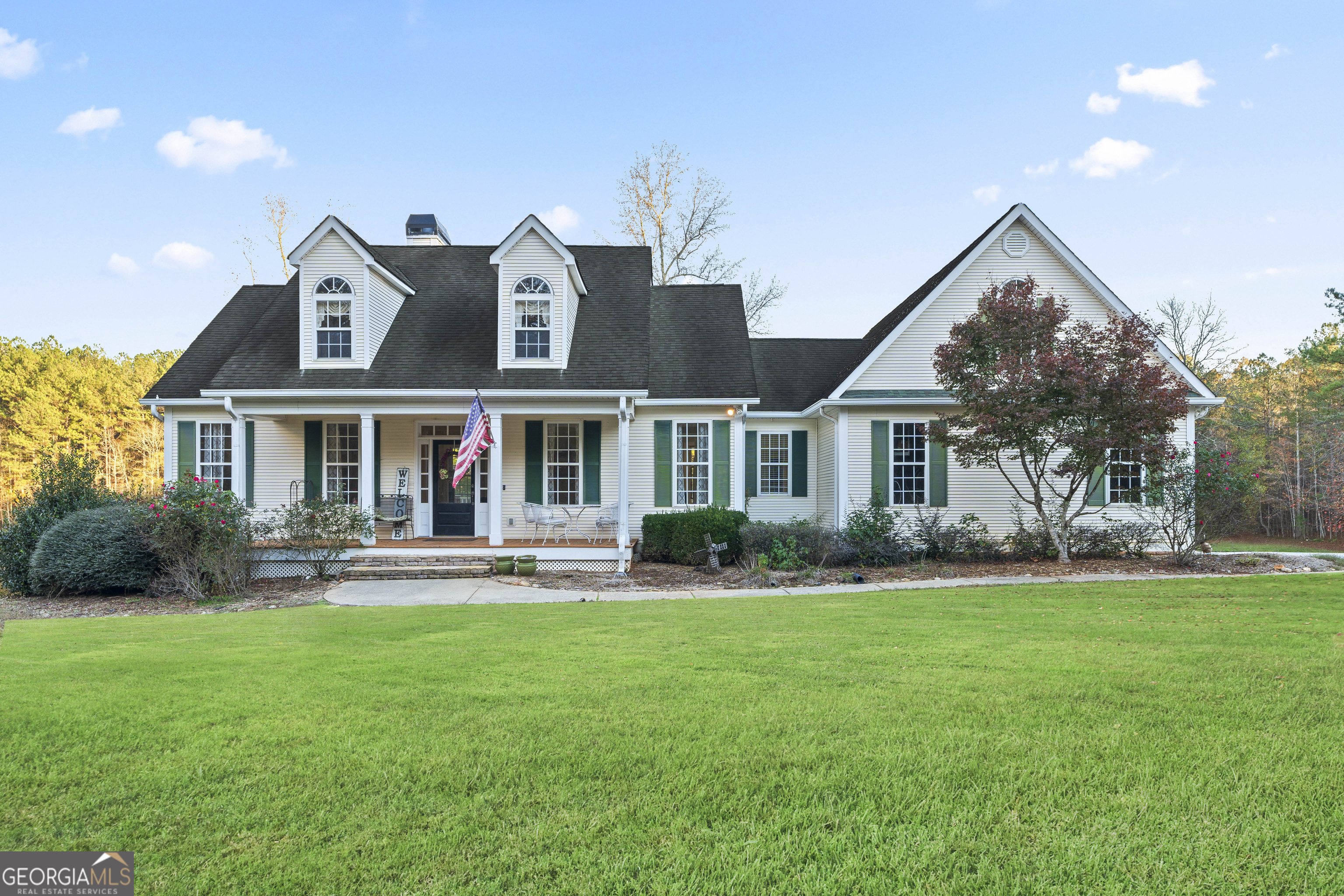 a front view of house with yard and green space