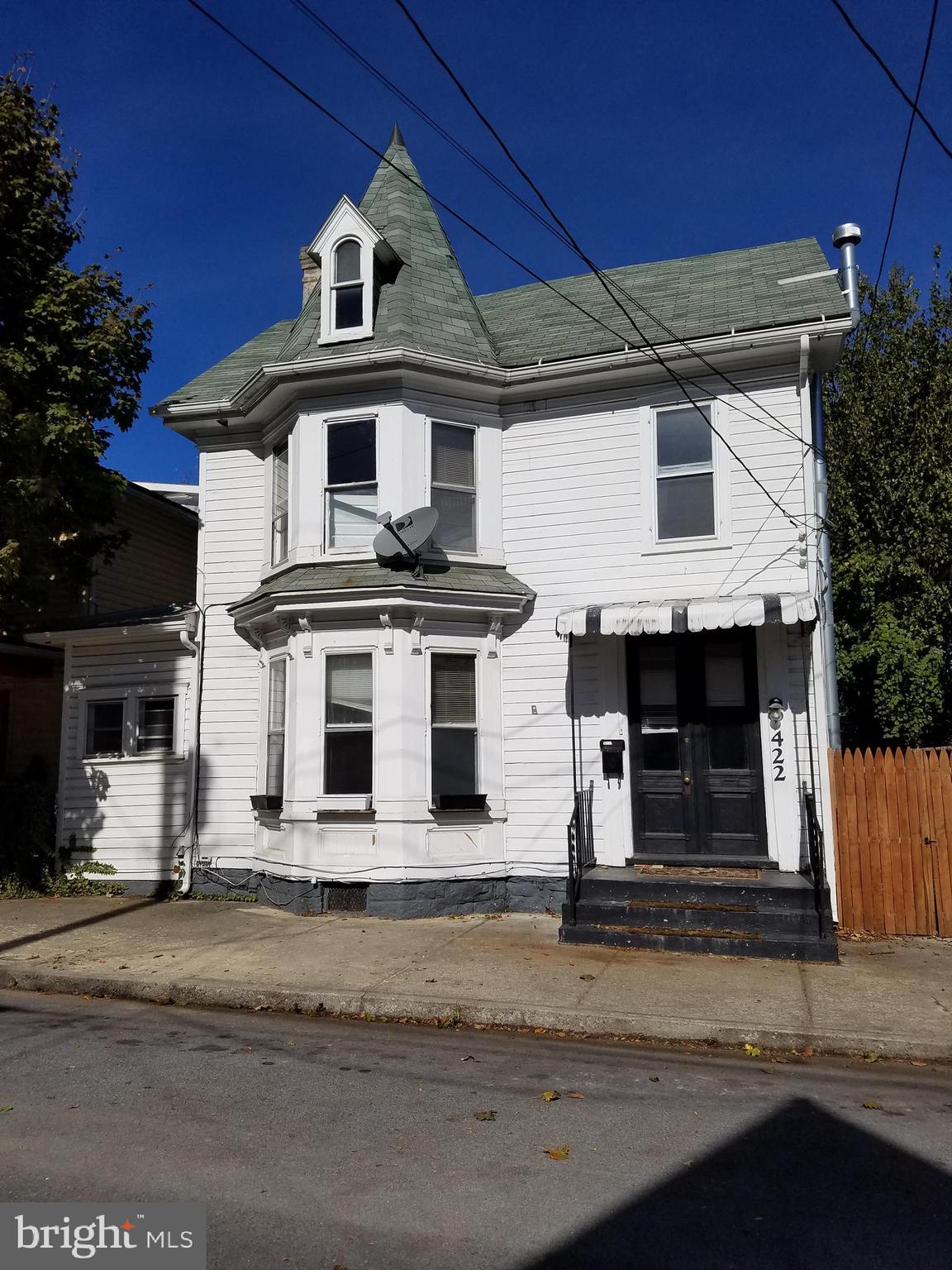 a front view of a house with garage