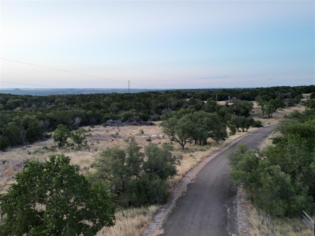 a view of a road with a building in background