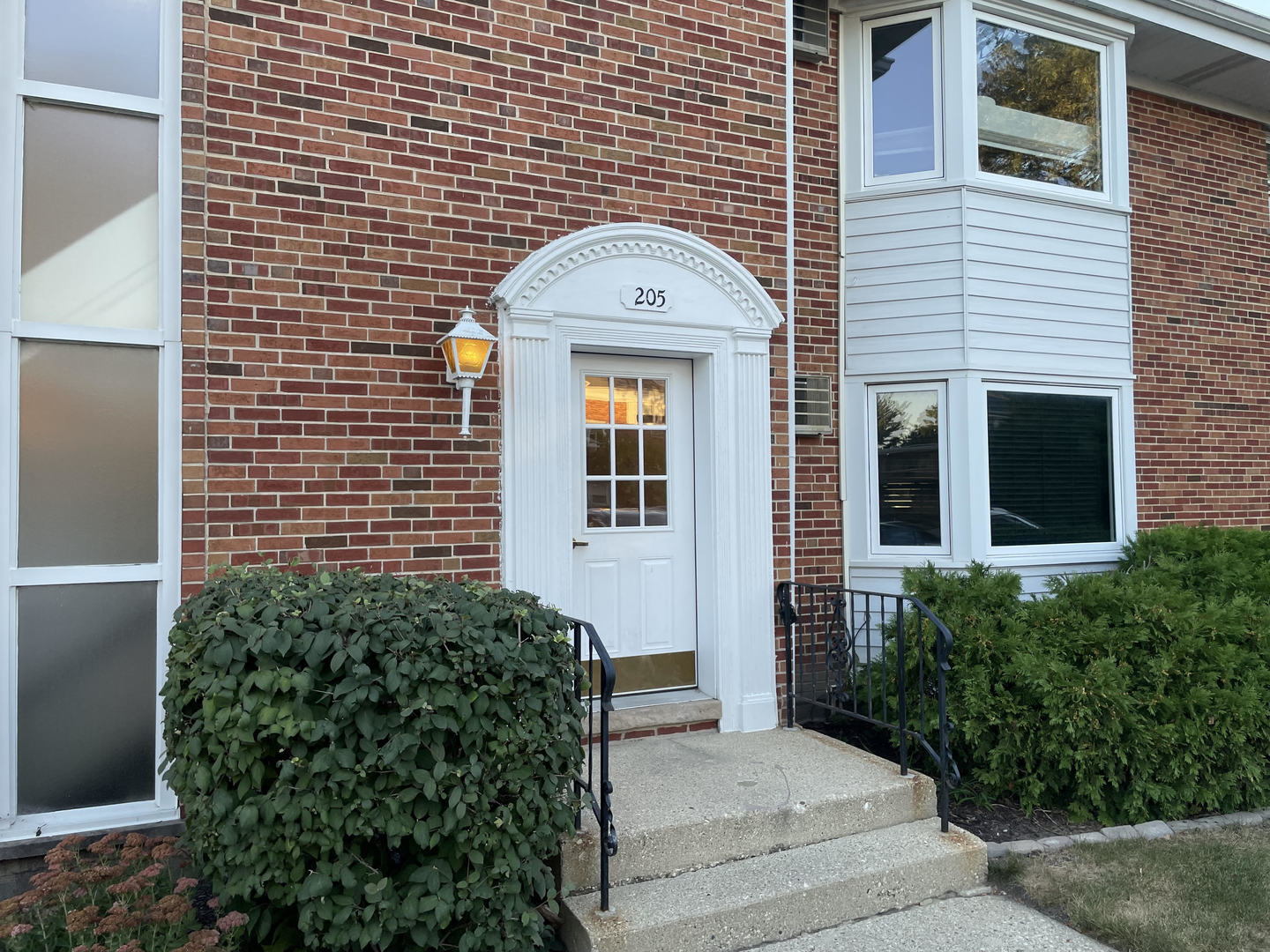 a front view of a house with a glass windows