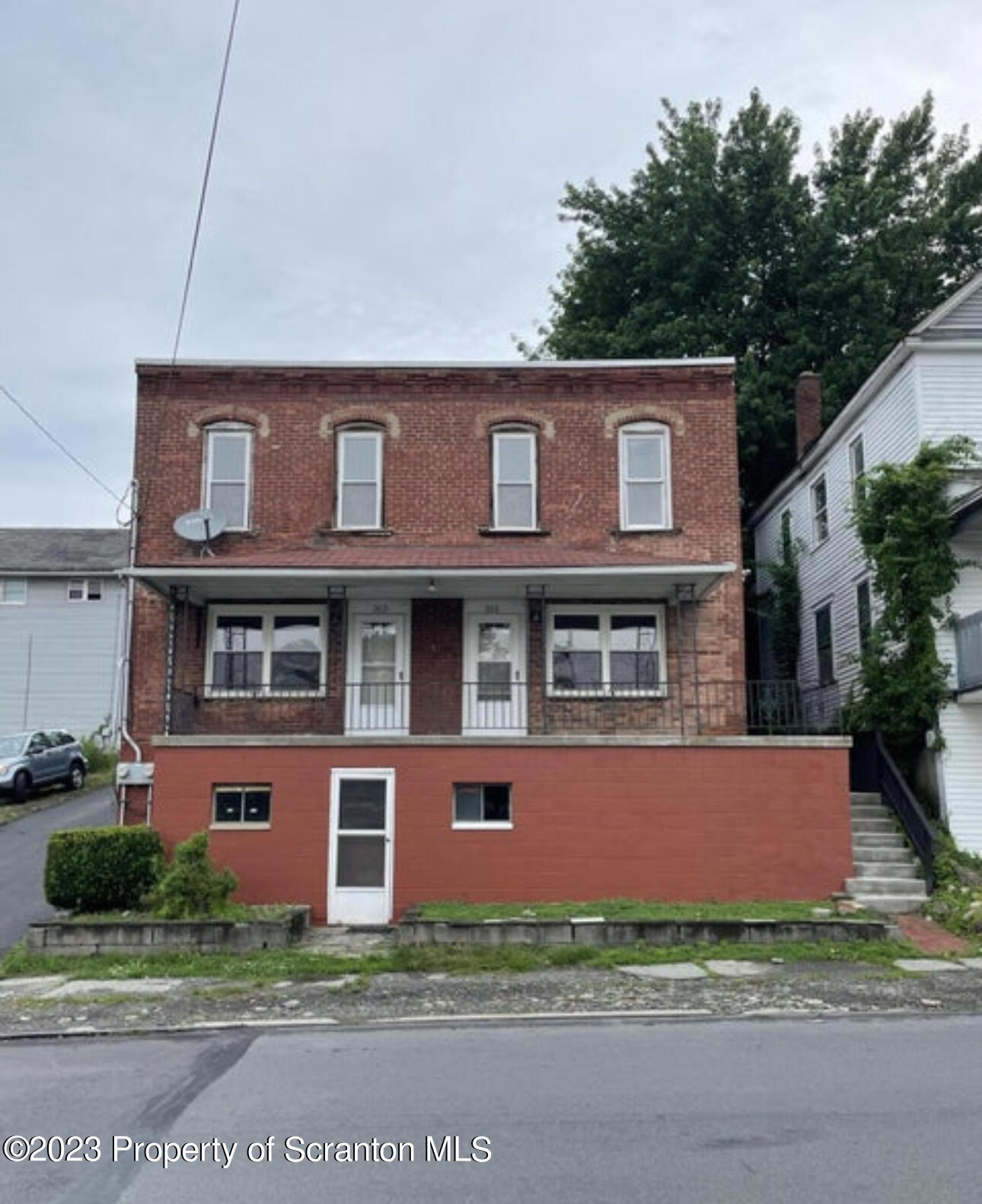 a front view of a house with yard