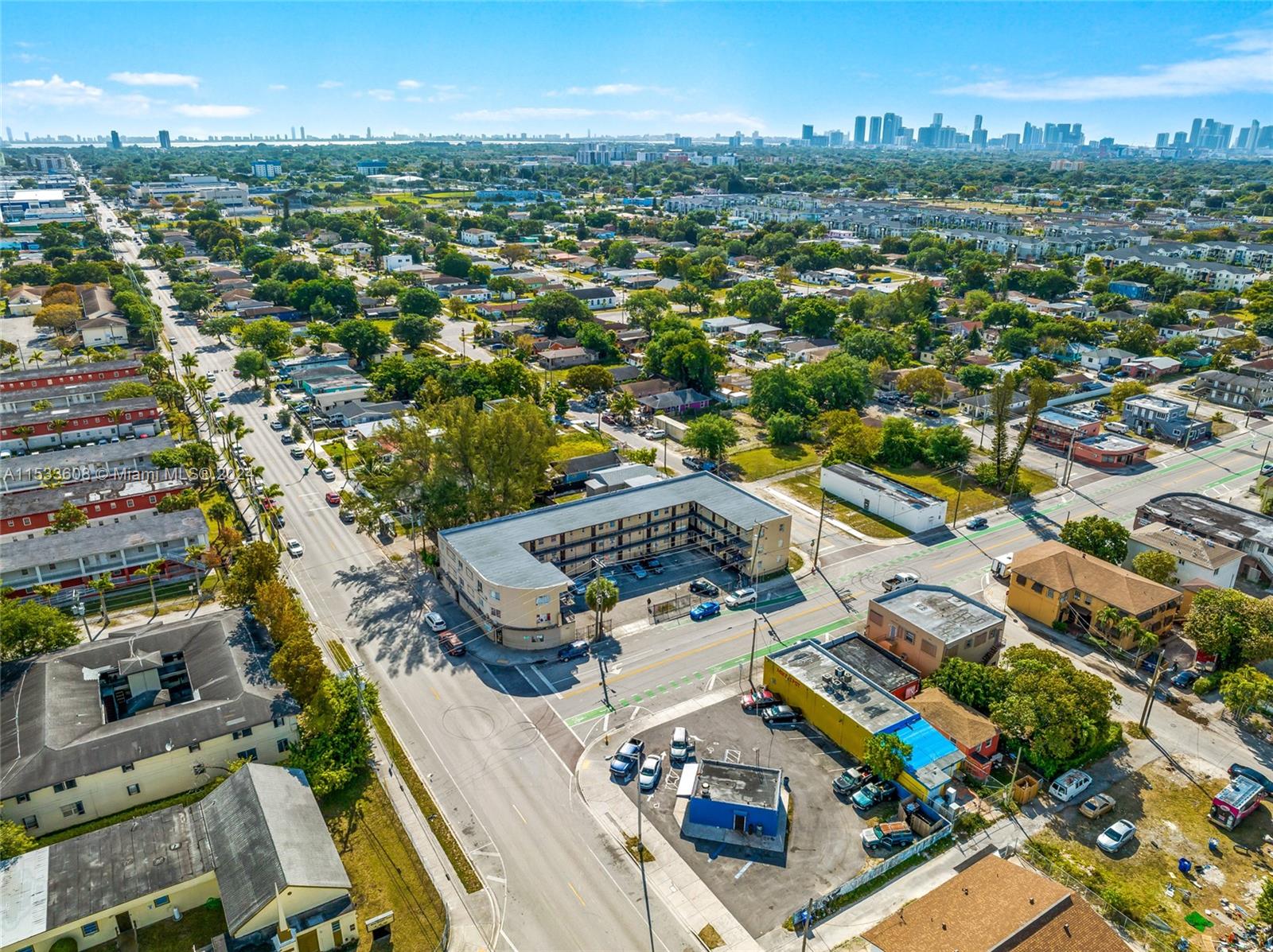 an aerial view of residential houses with city view