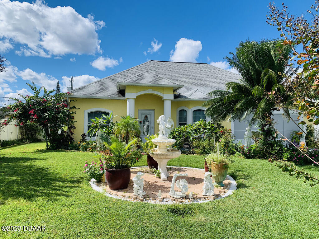 a front view of a house with a yard