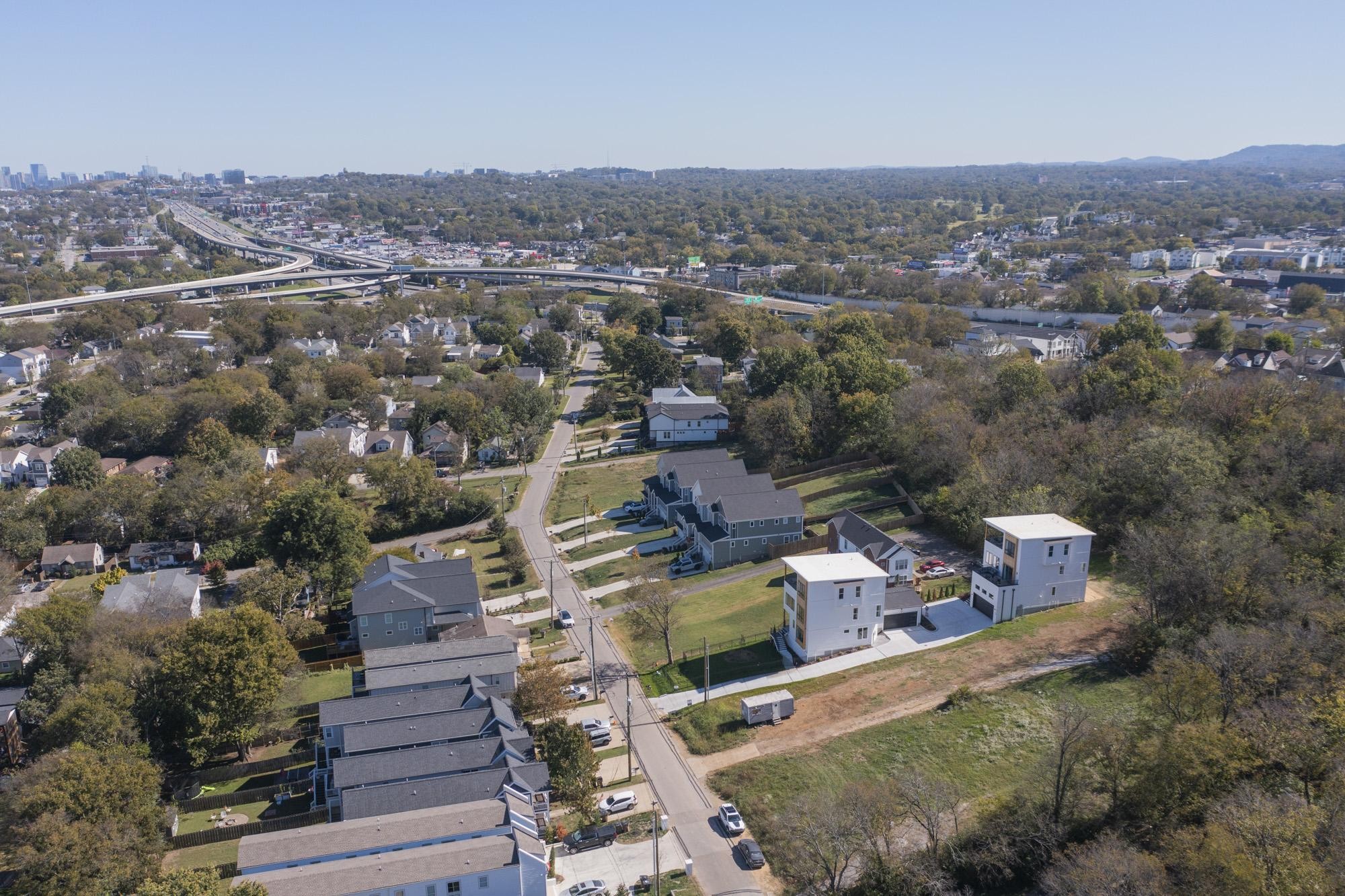 an aerial view of a city with lots of residential buildings