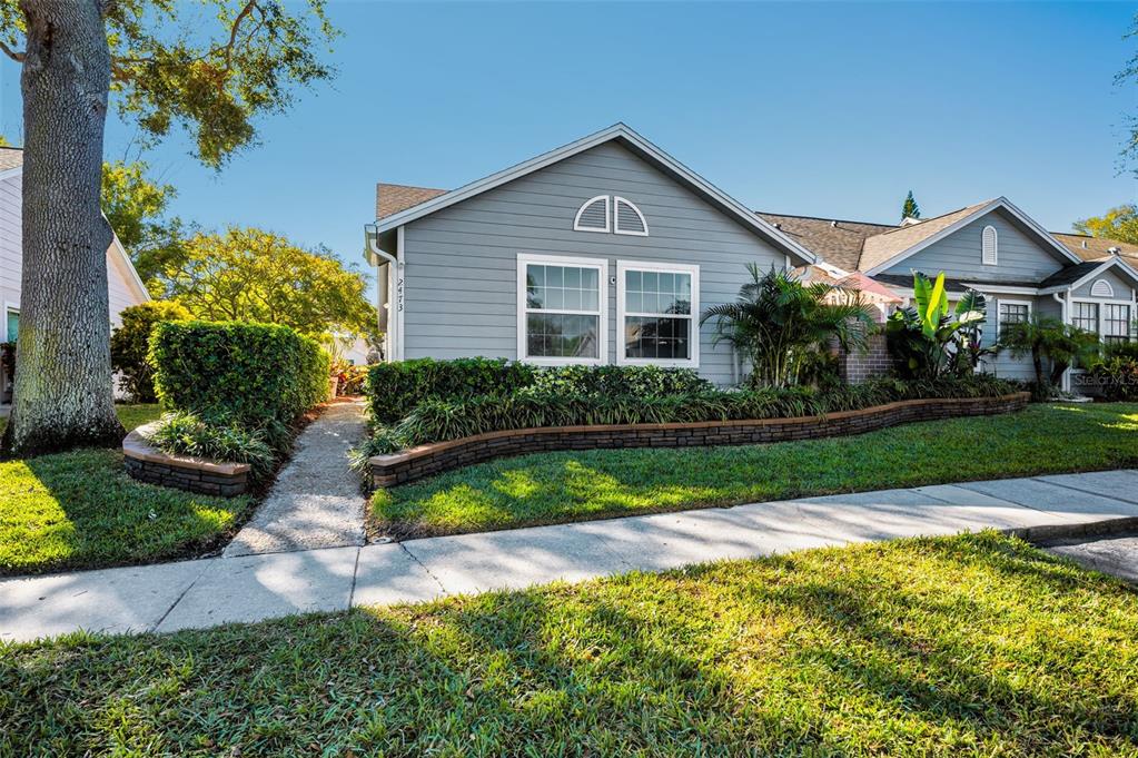 a front view of a house with garden