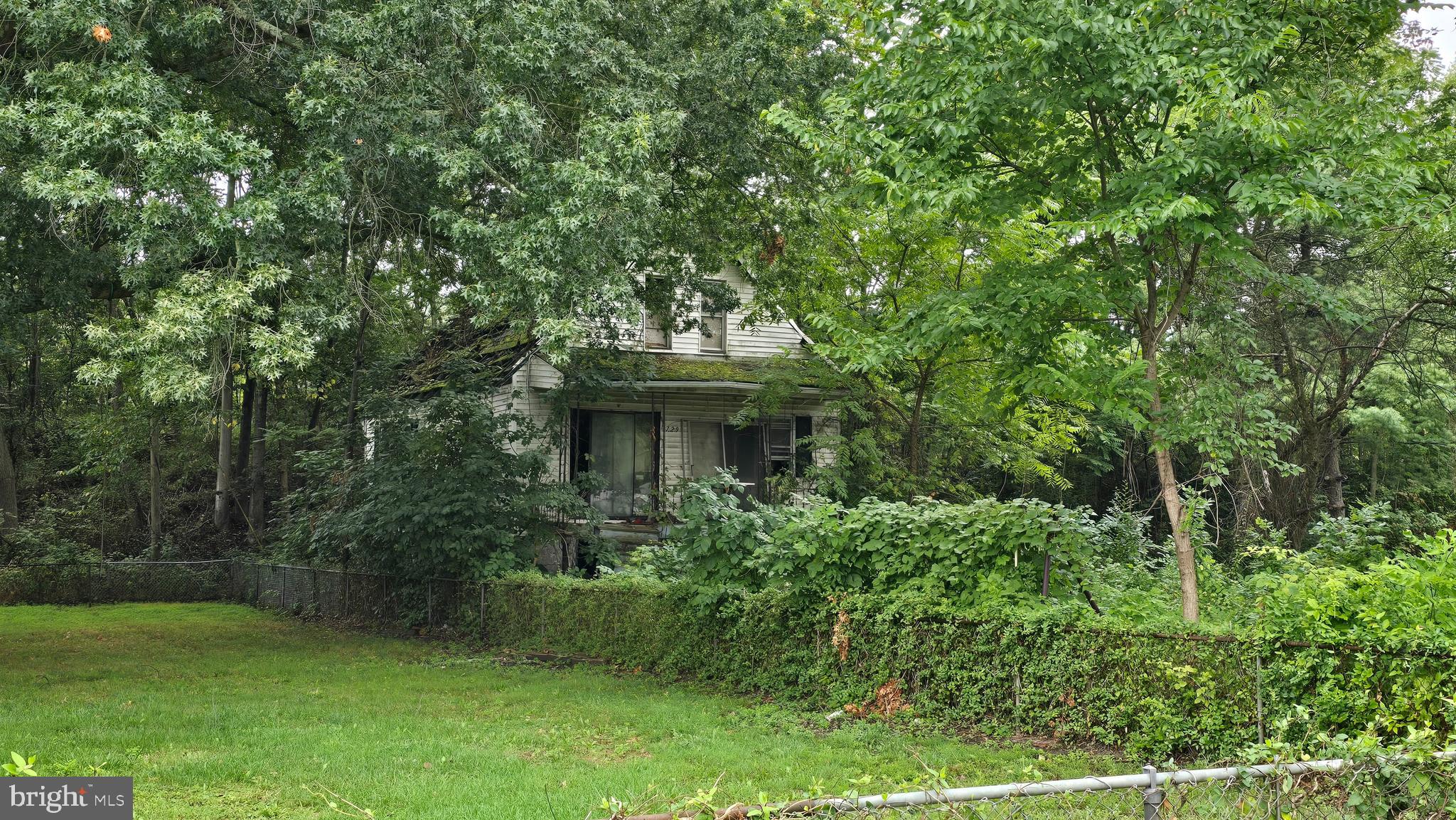 a view of a house with a tree