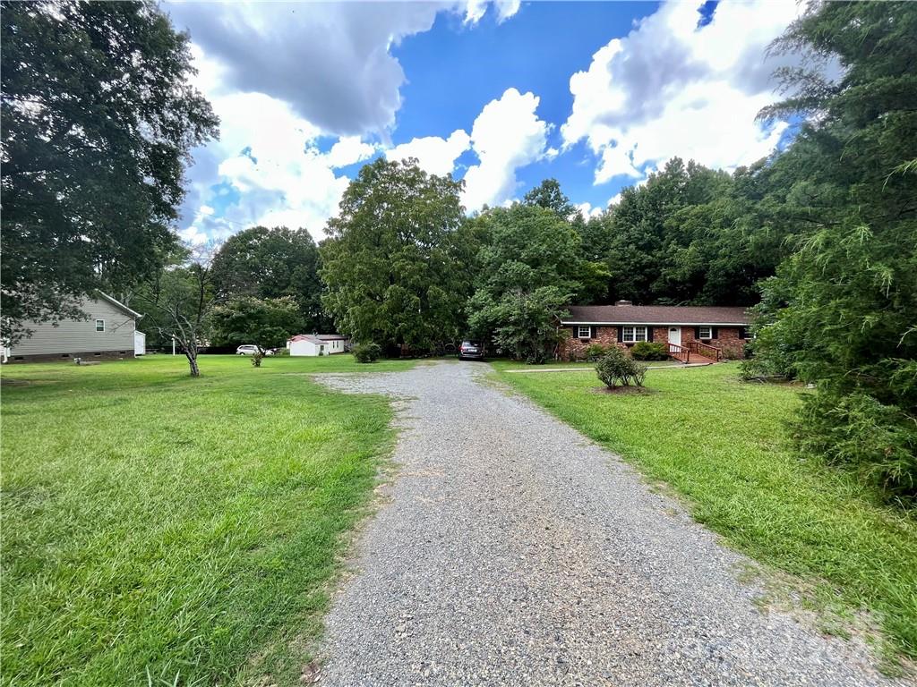 a view of a house with a big yard