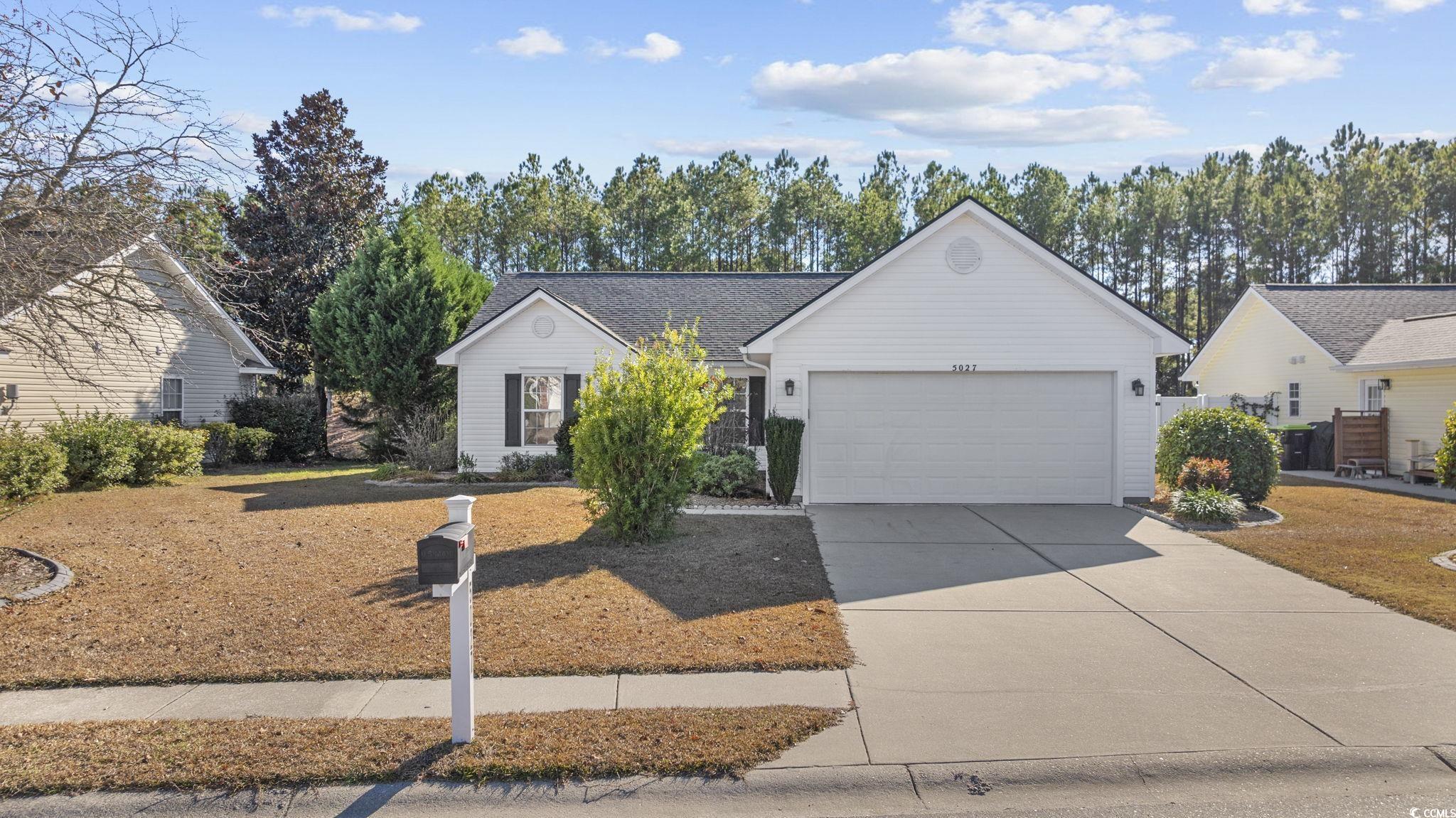 Ranch-style house with a garage