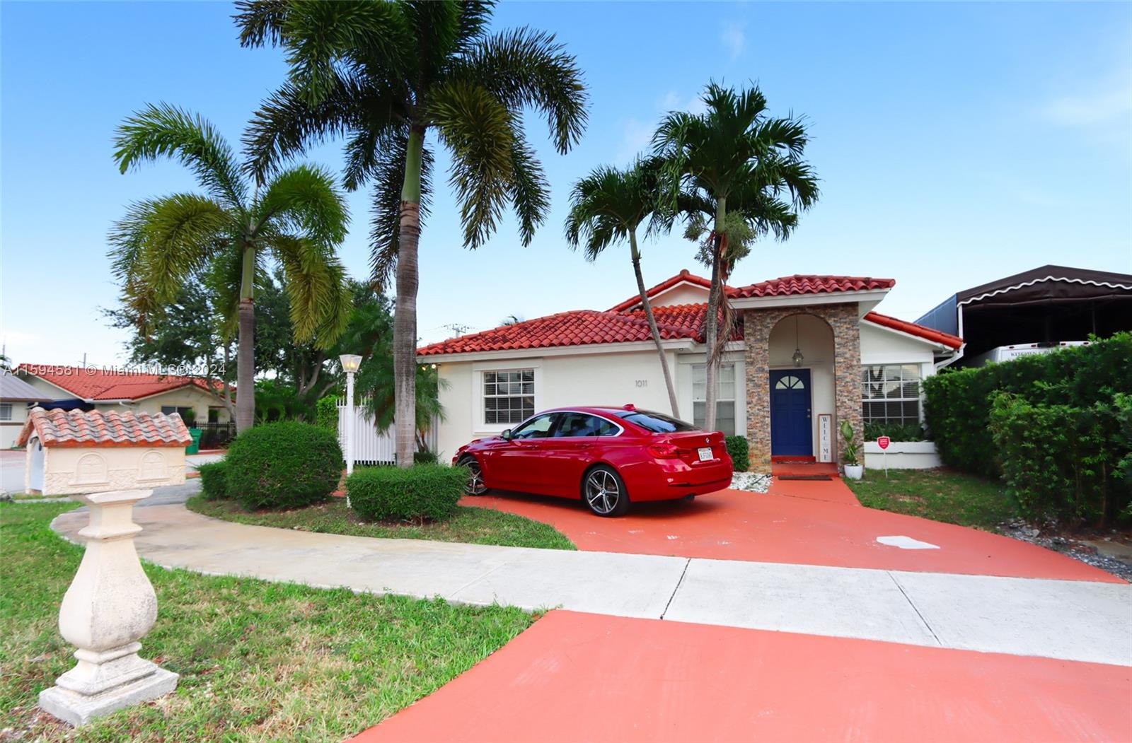 a front view of a house with garden