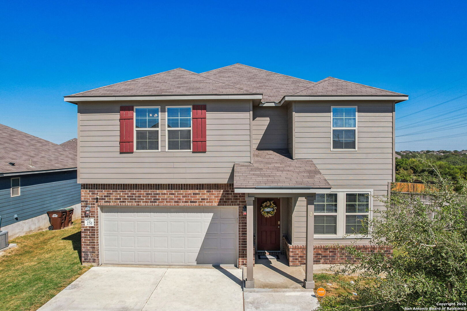 a front view of a house with a garage