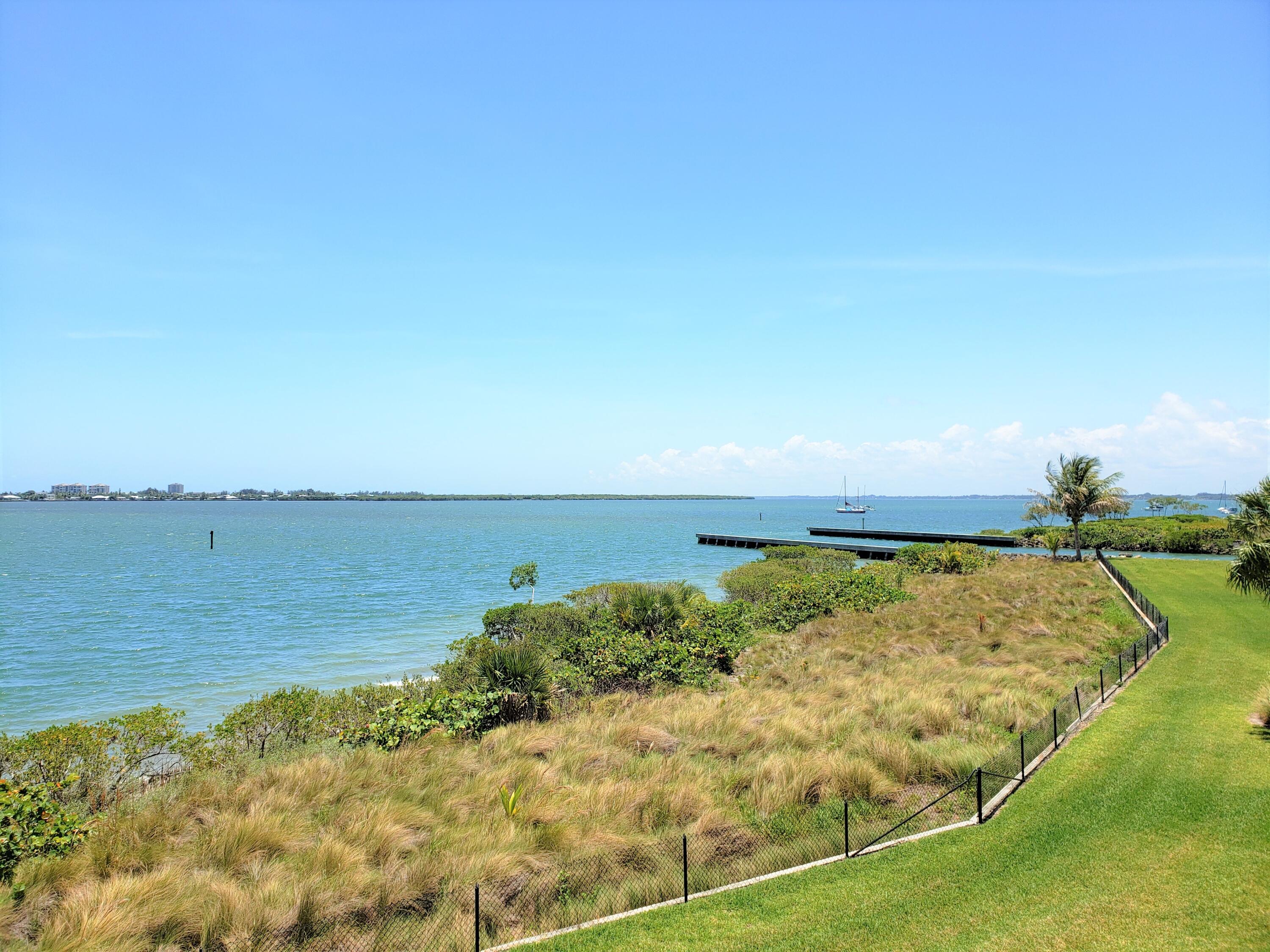 a view of a lake with a yard