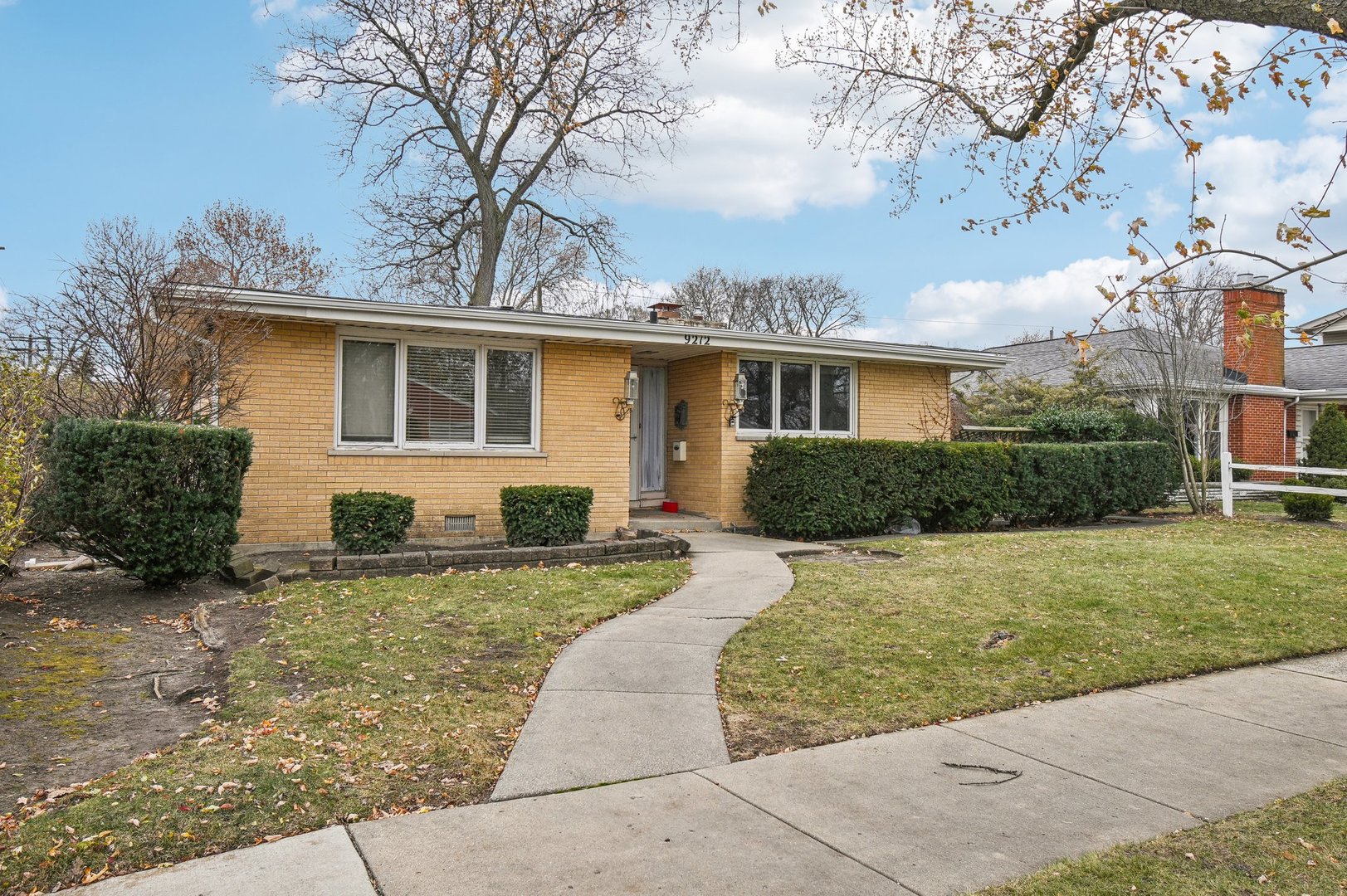 front view of a house with a yard