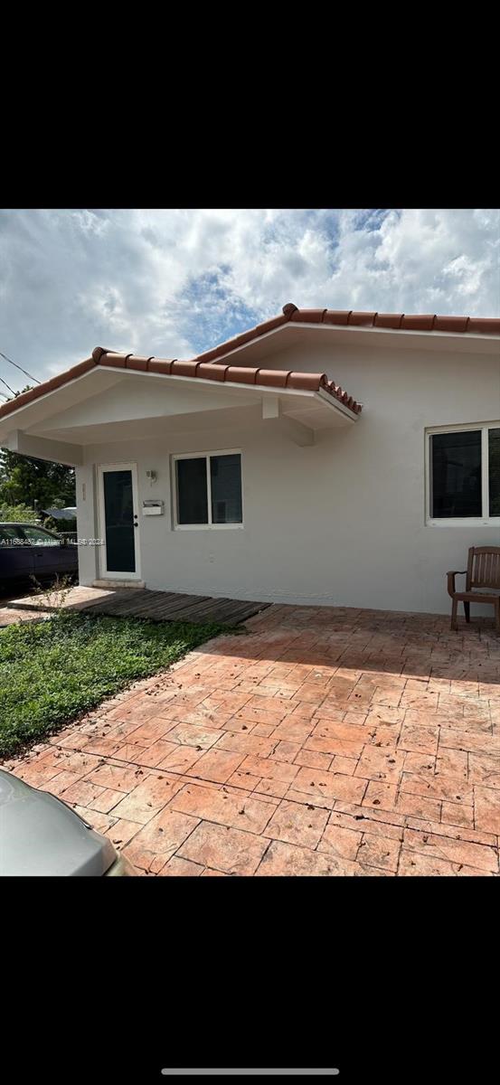 a view of front door and yard