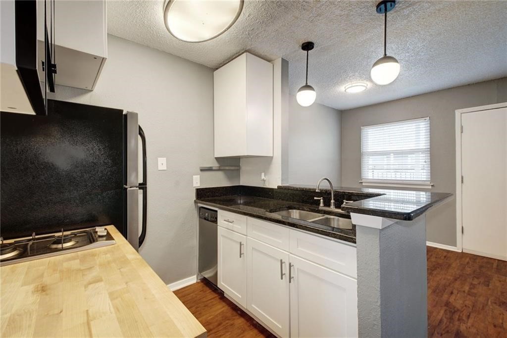 a kitchen with a sink and a stove