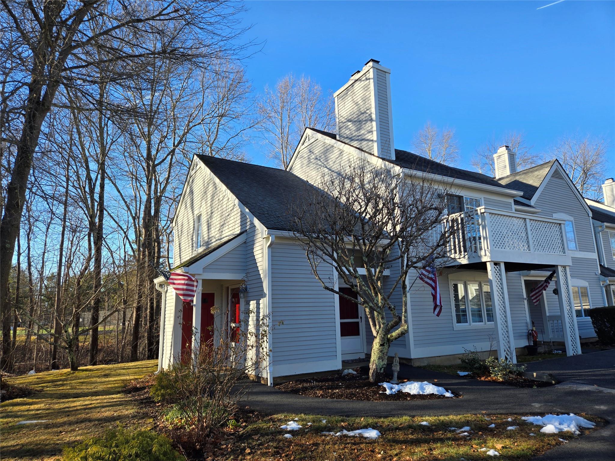 View of side of property with front balcony.