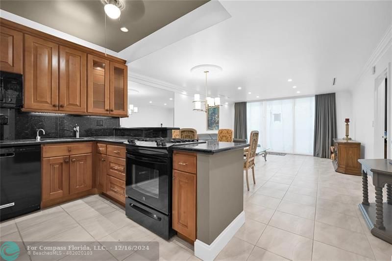 a kitchen with a sink cabinets and window