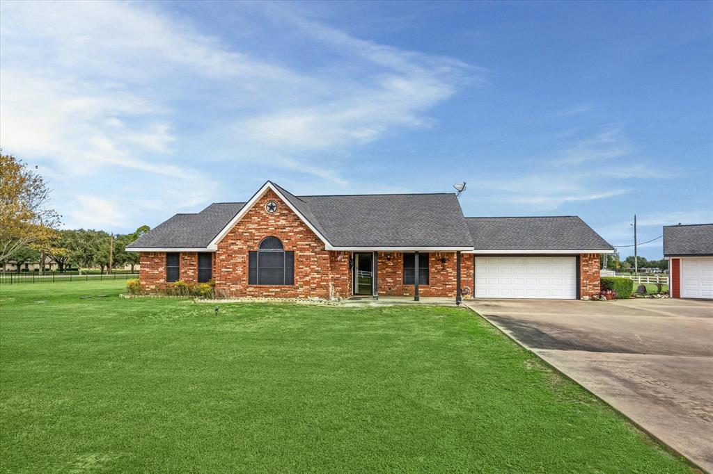 front view of a house with a yard