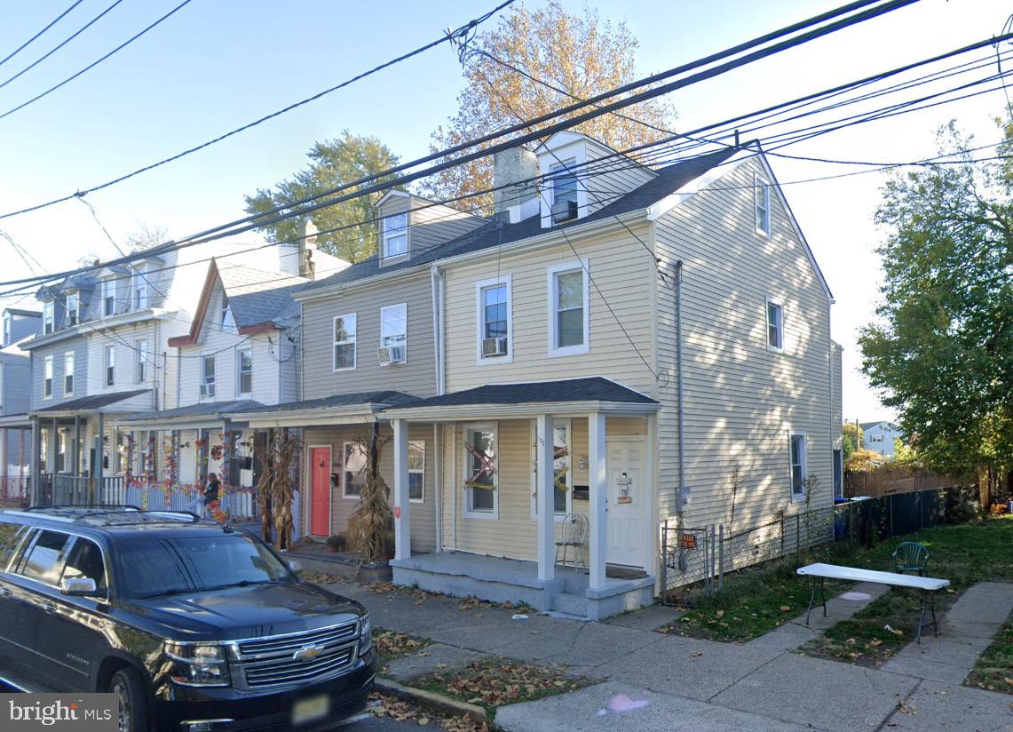 a view of a building with a yard