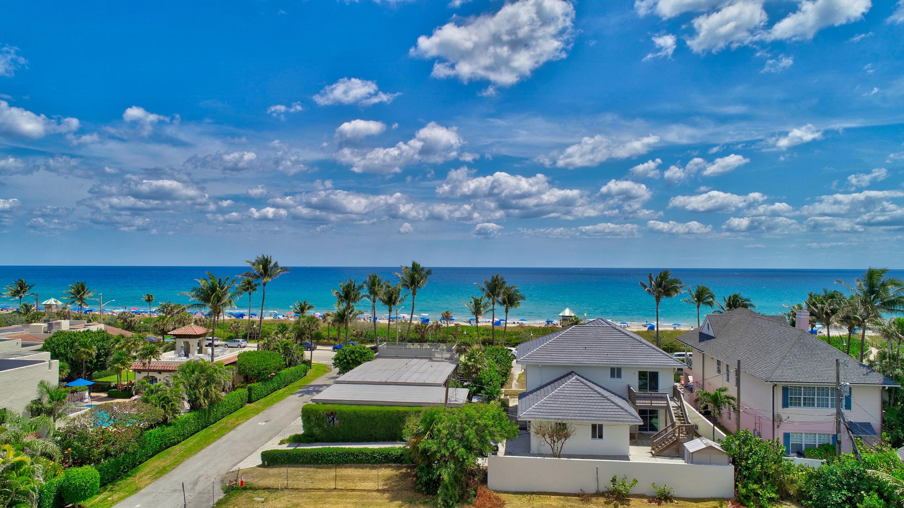 an aerial view of house with yard swimming pool and outdoor seating