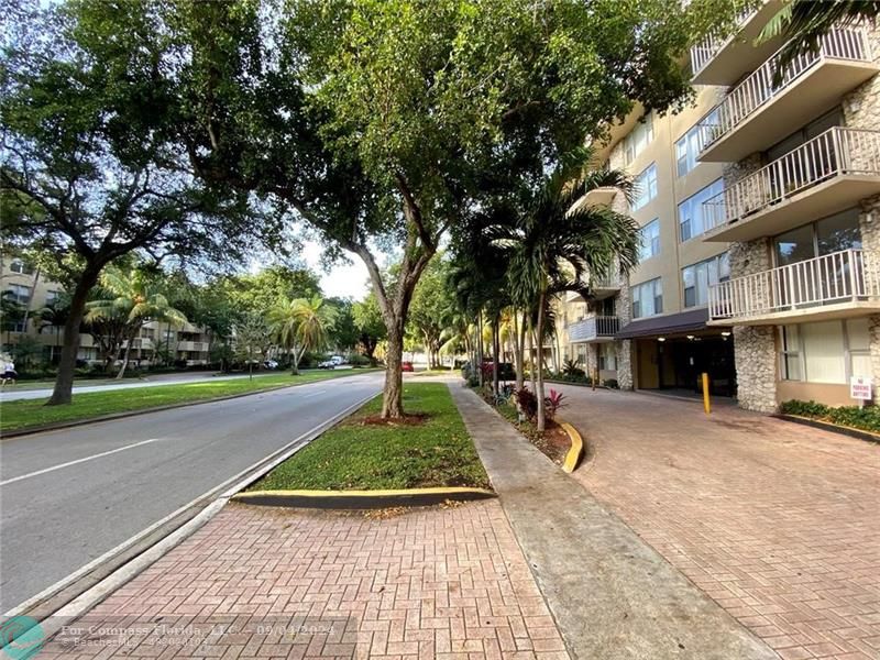 a view of a street with houses on both side