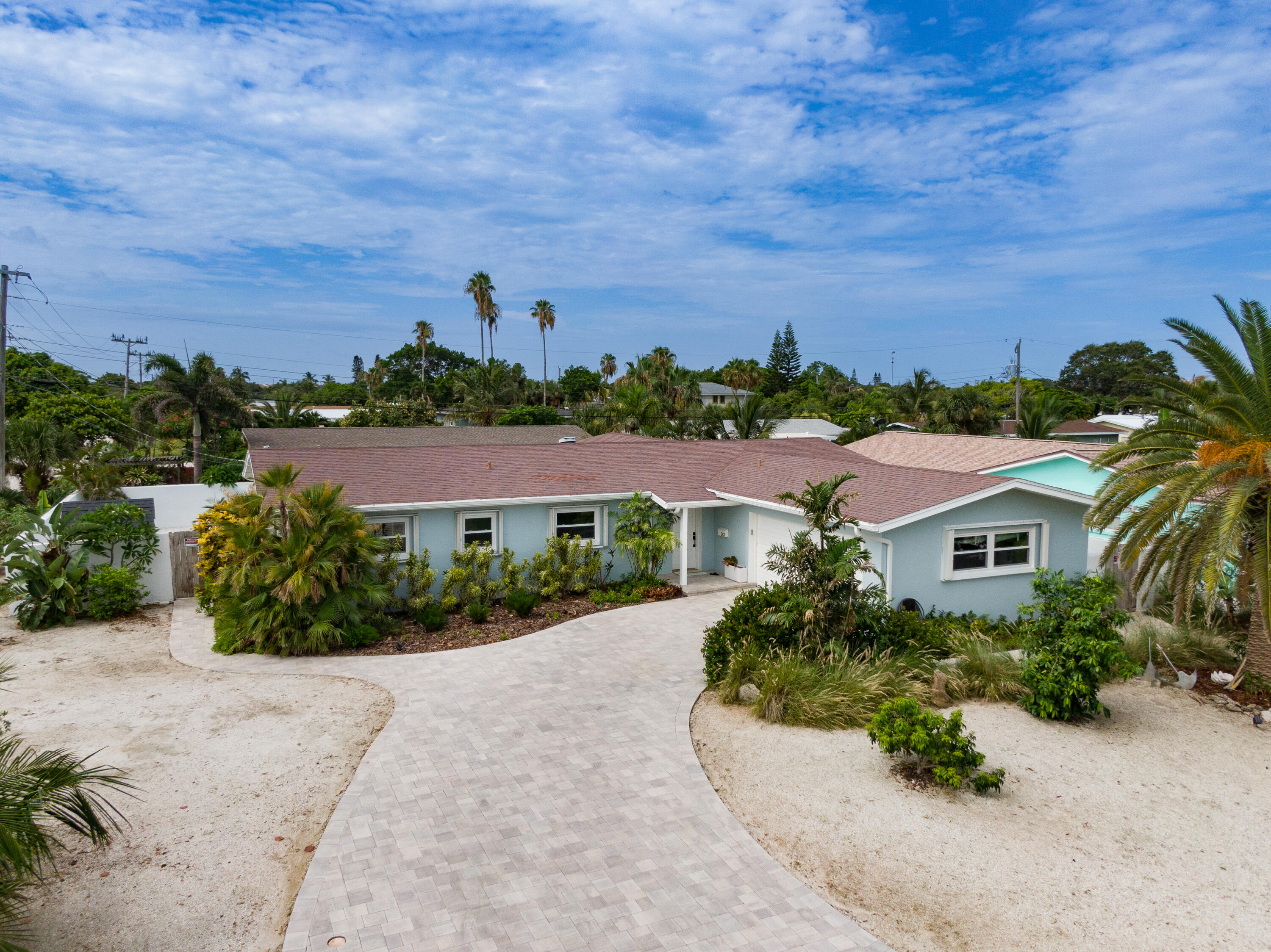 an aerial view of a house with a garden