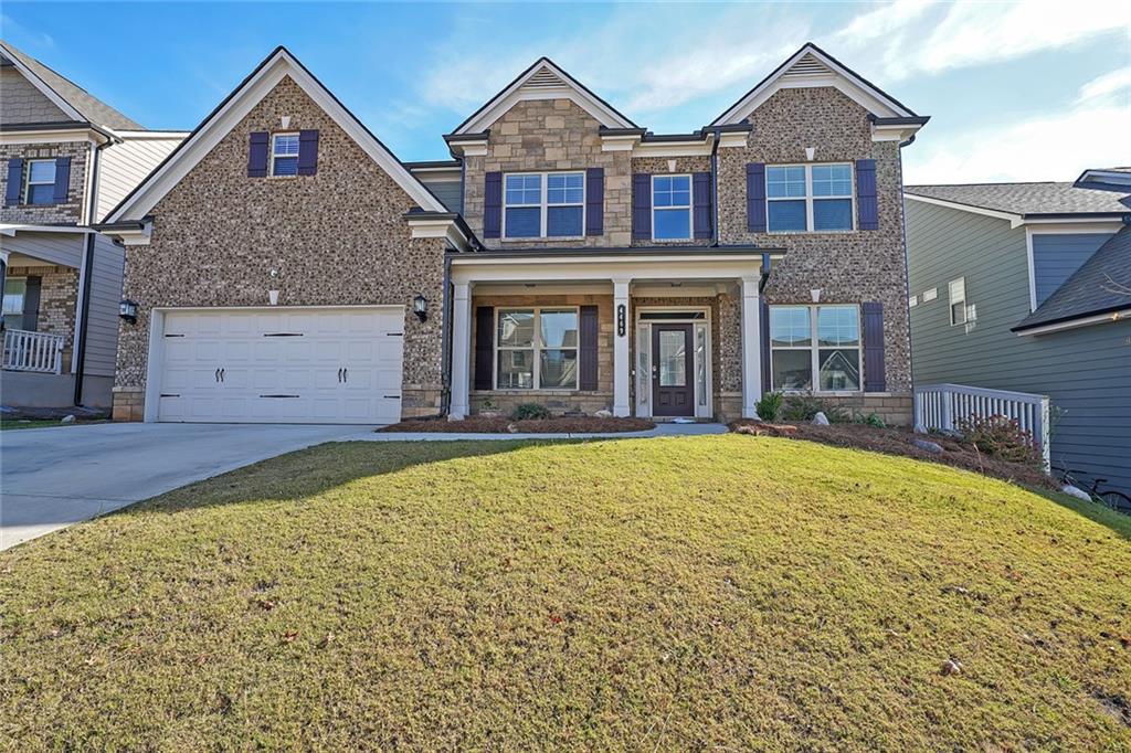 a front view of a house with a yard