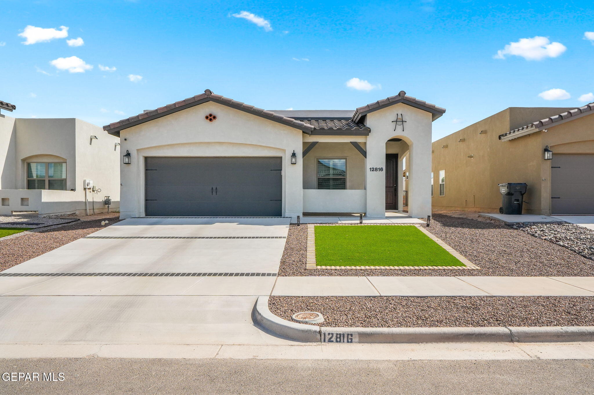 a front view of a house with garage